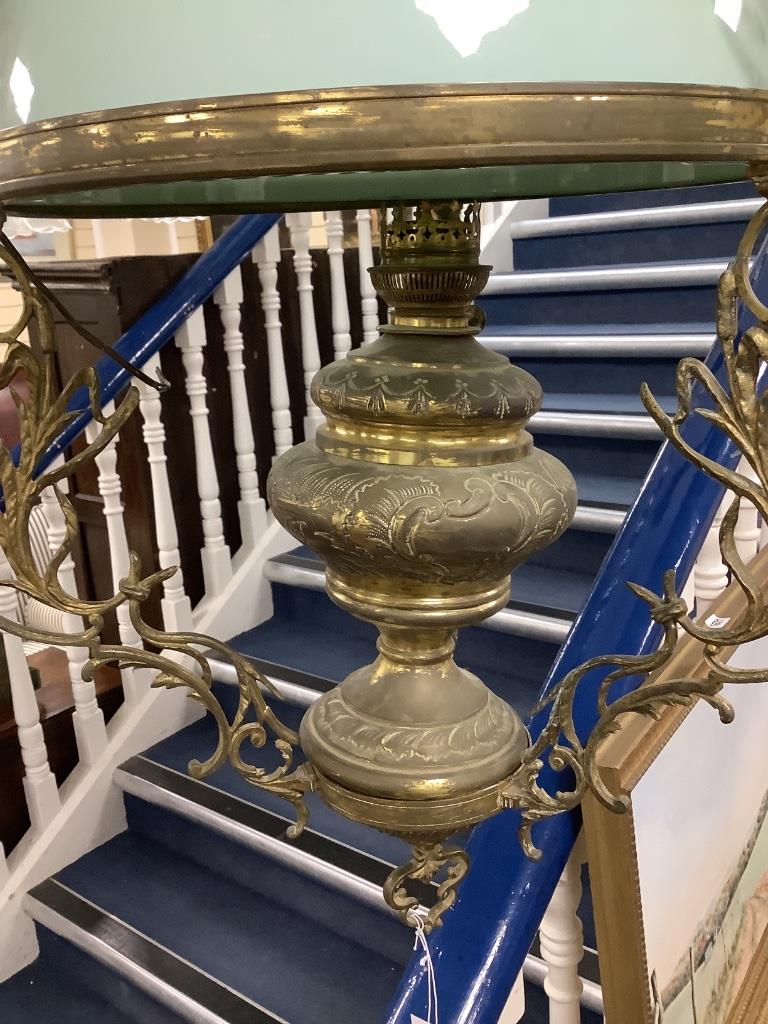 An early 20th century brass hanging oil lamp, drop 85cm